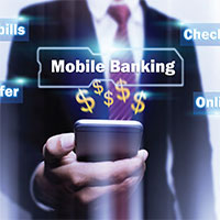 Man holding a phone with mobile banking hovering over the phone.